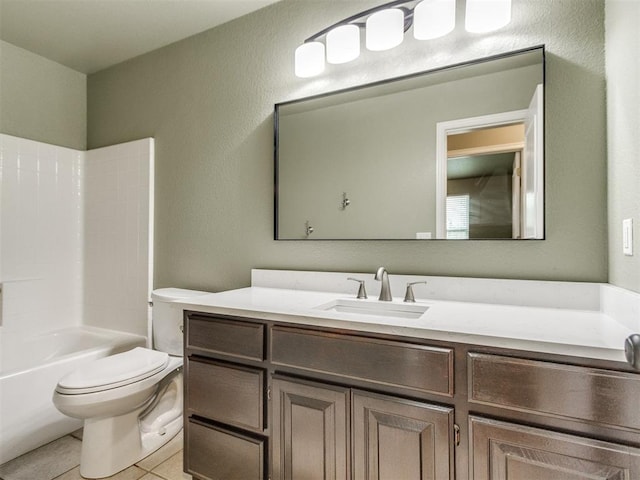 full bathroom featuring vanity, tile patterned floors, toilet, and washtub / shower combination