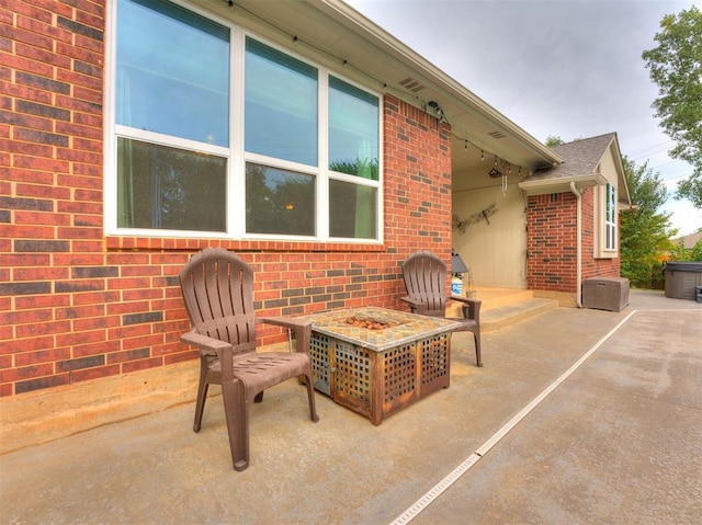 view of patio featuring a fire pit