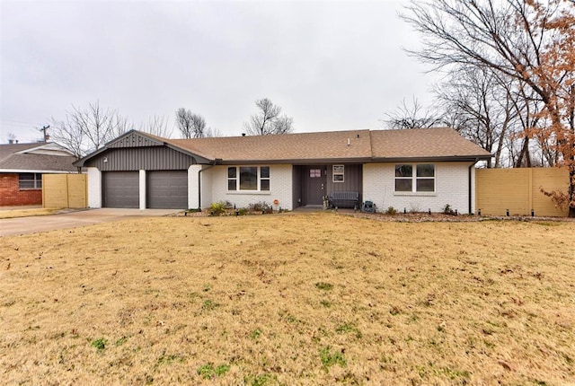 single story home with a garage and a front yard