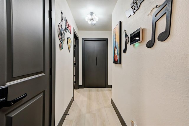 hall with light wood-type flooring