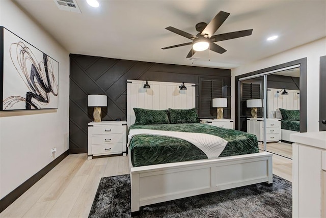 bedroom featuring light hardwood / wood-style flooring and ceiling fan