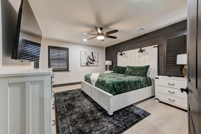 bedroom featuring ceiling fan and light hardwood / wood-style floors