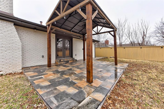 view of patio with french doors and a gazebo