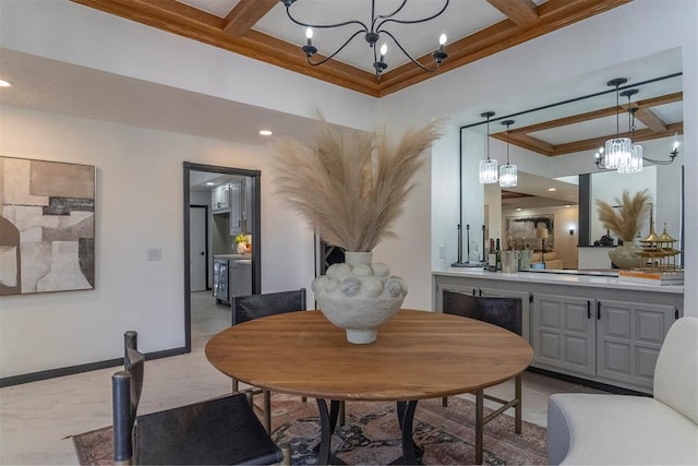 dining room featuring ornamental molding, coffered ceiling, and a chandelier