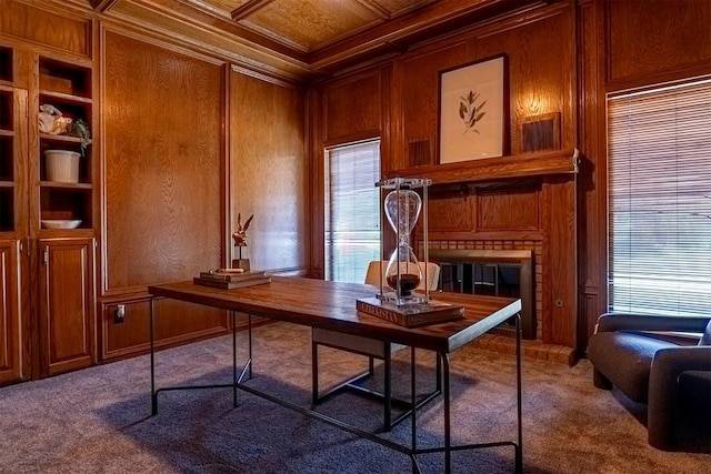 office area with wooden walls, carpet flooring, coffered ceiling, crown molding, and plenty of natural light