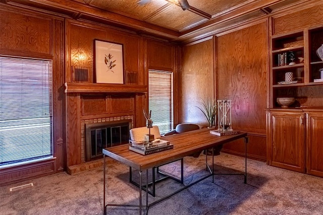 office featuring coffered ceiling, crown molding, carpet floors, and wood walls