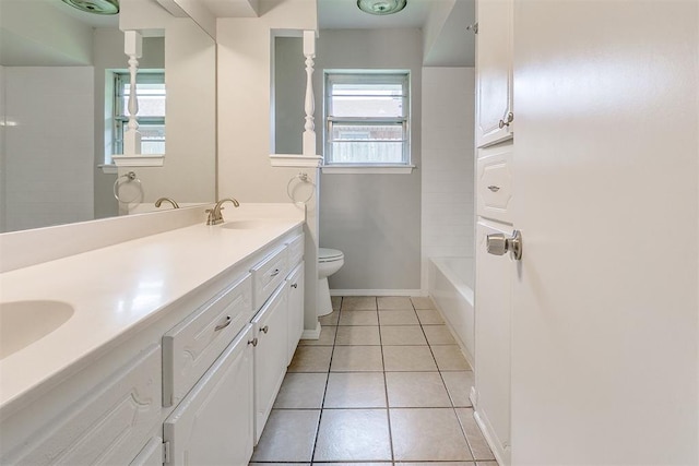 full bath featuring plenty of natural light, a sink, tile patterned flooring, and toilet