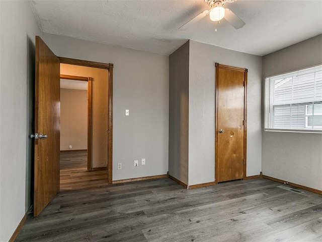 unfurnished bedroom with hardwood / wood-style flooring and ceiling fan