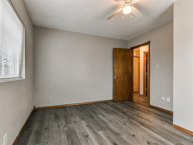 unfurnished room featuring hardwood / wood-style floors and ceiling fan