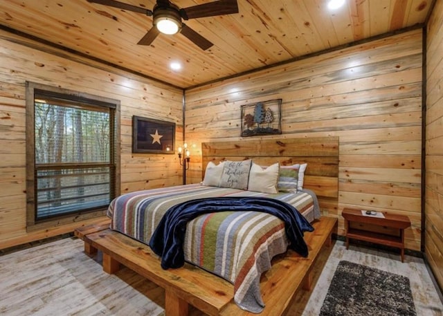 bedroom with hardwood / wood-style flooring, wooden walls, and wooden ceiling