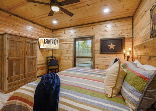 carpeted bedroom with wooden walls and wood ceiling