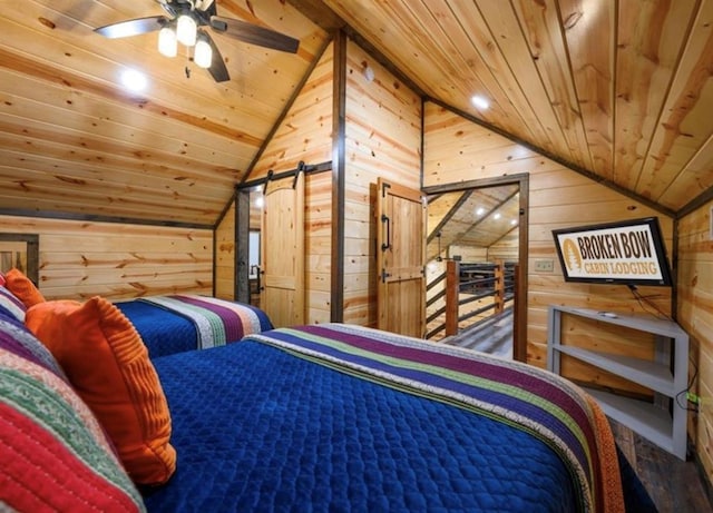 bedroom with lofted ceiling, wooden ceiling, and wood walls