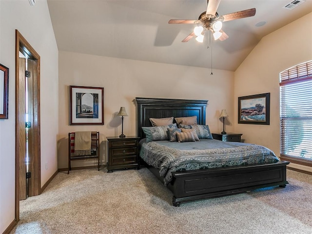 bedroom featuring ceiling fan, light colored carpet, and lofted ceiling