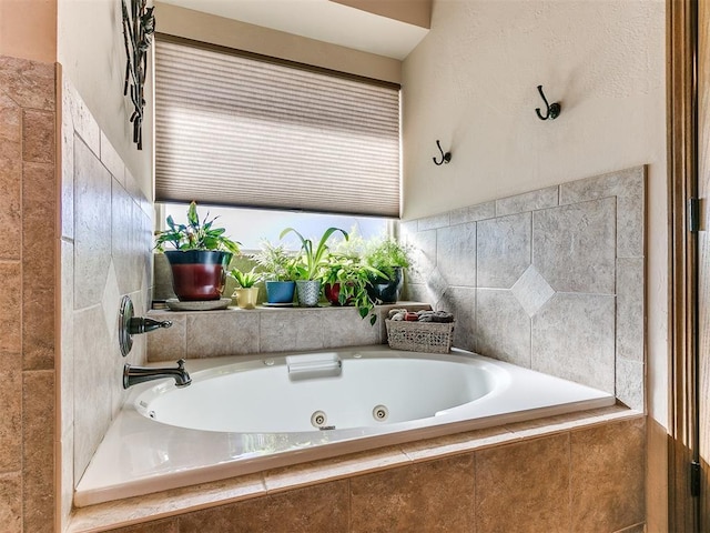 bathroom with tiled tub