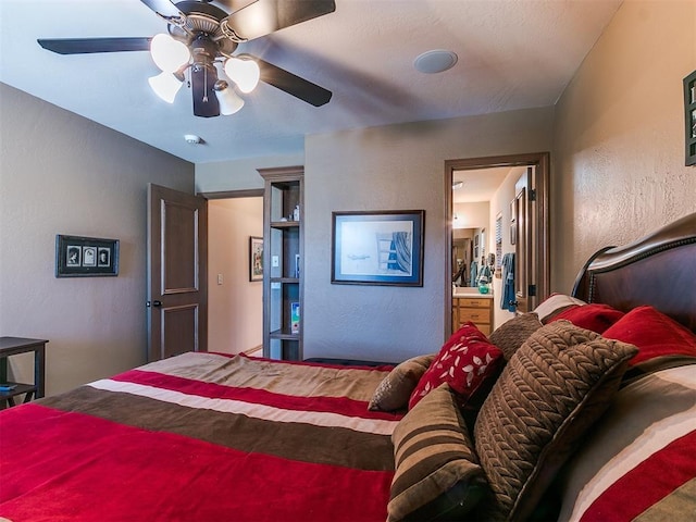 bedroom with ceiling fan and ensuite bath