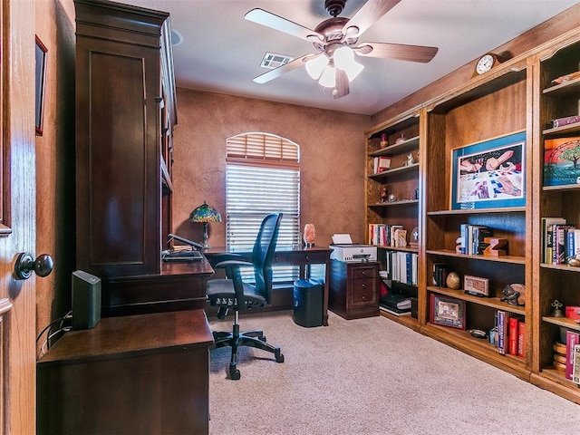 office space featuring ceiling fan and carpet