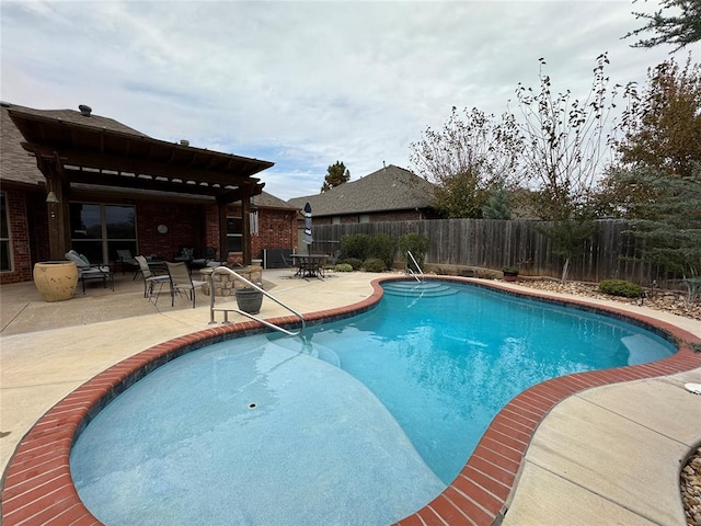 view of swimming pool with a patio