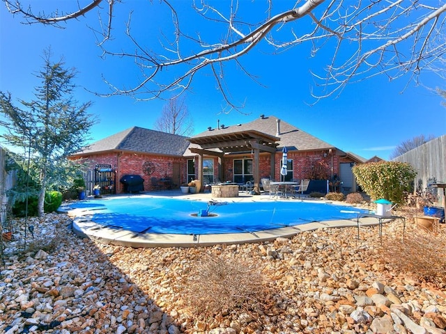 view of pool featuring grilling area and a patio area