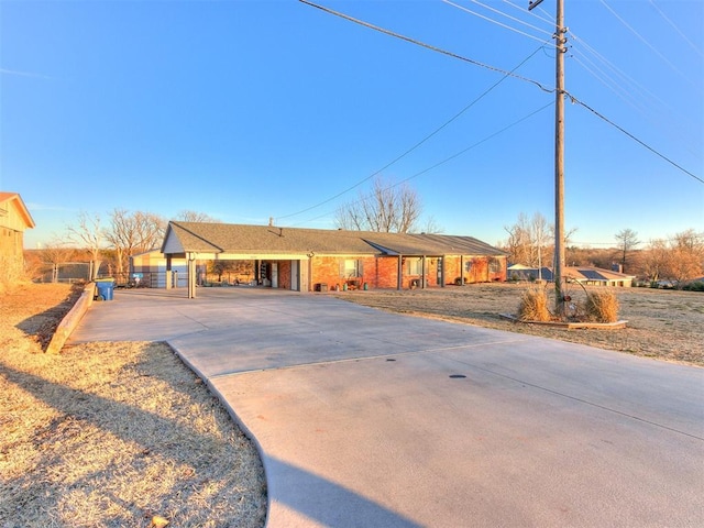 ranch-style home featuring a carport