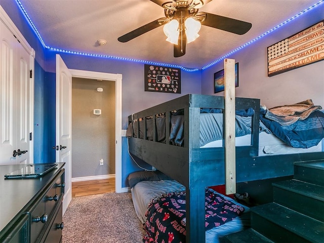 bedroom with light wood-type flooring and ceiling fan