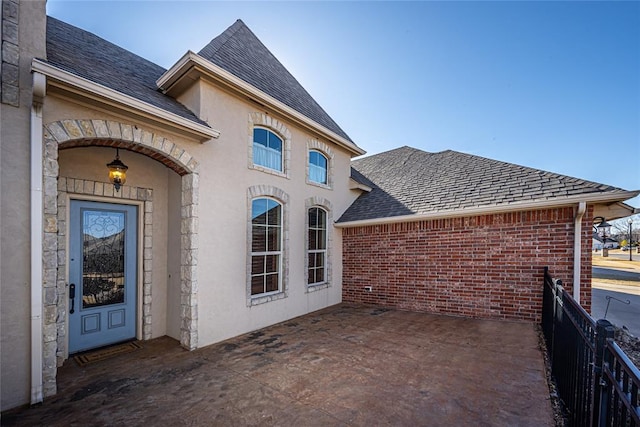 doorway to property featuring a patio area