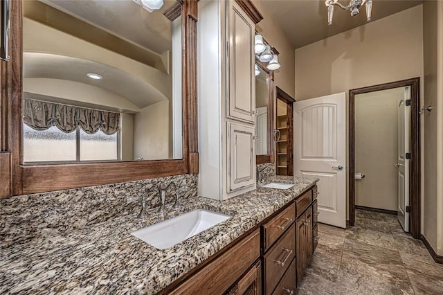 bathroom with vanity and decorative backsplash