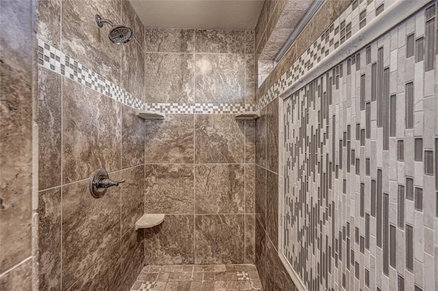 bathroom with tiled shower