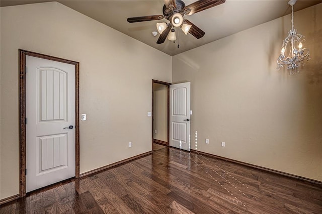 unfurnished bedroom with dark hardwood / wood-style floors and ceiling fan with notable chandelier