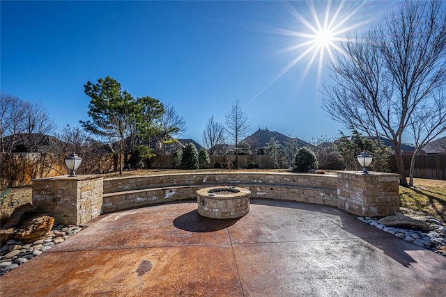 view of patio featuring a mountain view and a fire pit