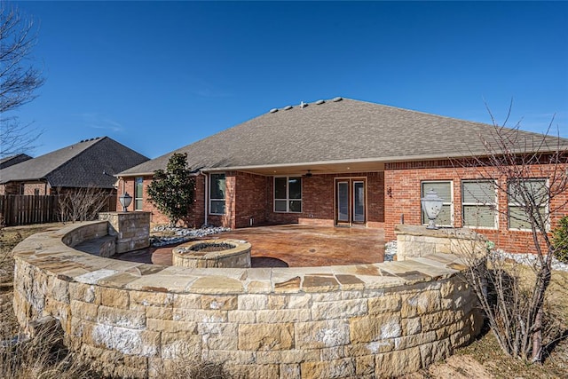 back of house featuring a patio area and an outdoor fire pit