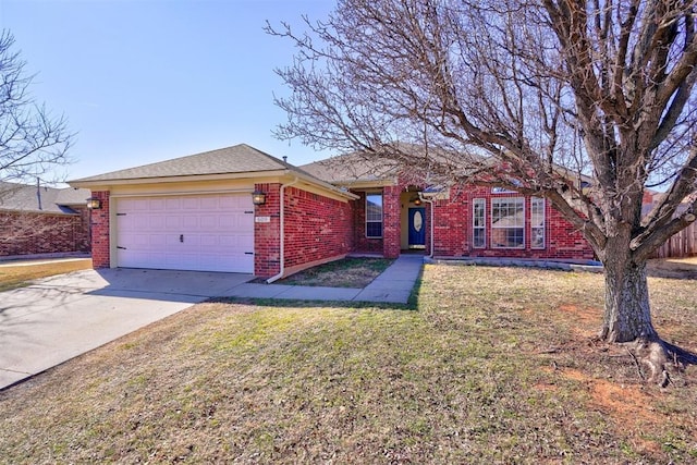 single story home featuring a garage and a front lawn