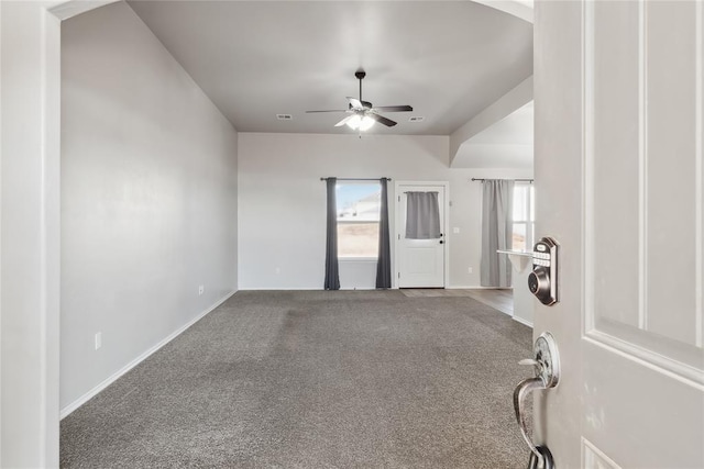 carpeted empty room featuring ceiling fan