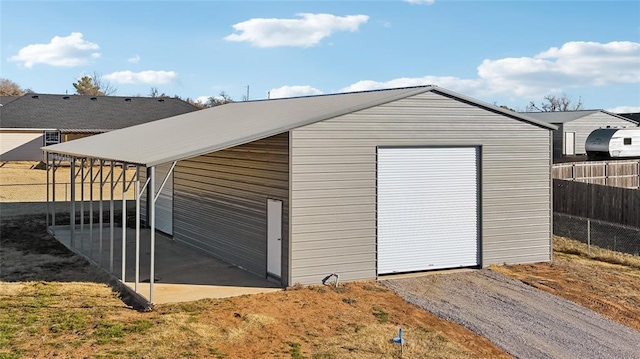 garage featuring a carport