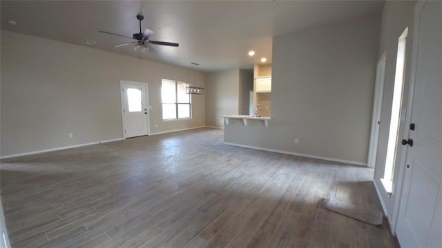 foyer entrance featuring hardwood / wood-style floors and ceiling fan