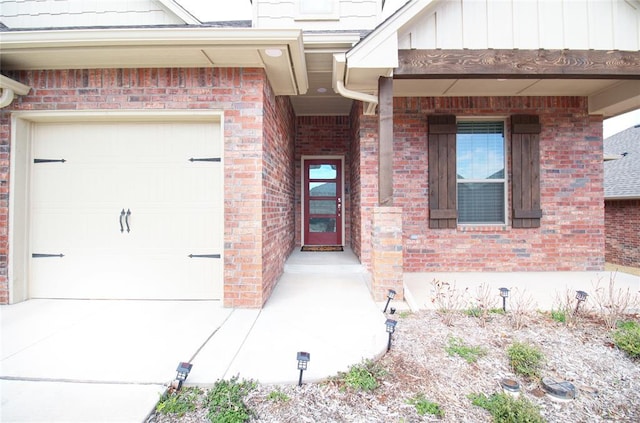 view of exterior entry with a garage