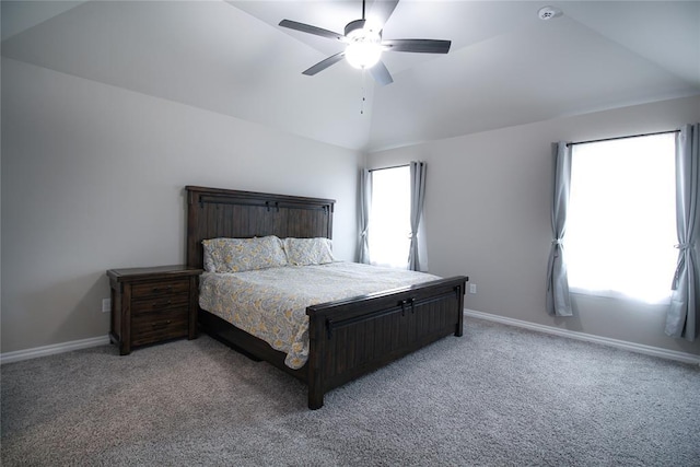 bedroom featuring vaulted ceiling, carpet floors, and ceiling fan