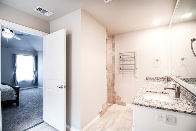 bathroom featuring vanity, radiator heating unit, and ceiling fan