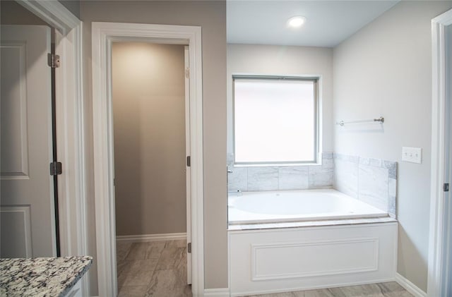 bathroom featuring a tub