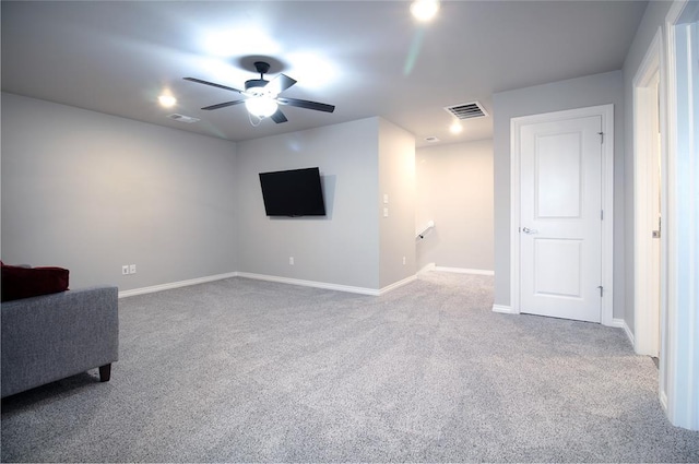 interior space with ceiling fan and carpet floors