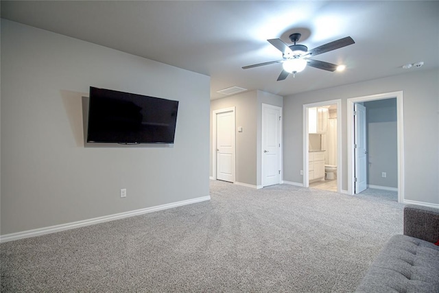 unfurnished living room featuring light carpet and ceiling fan