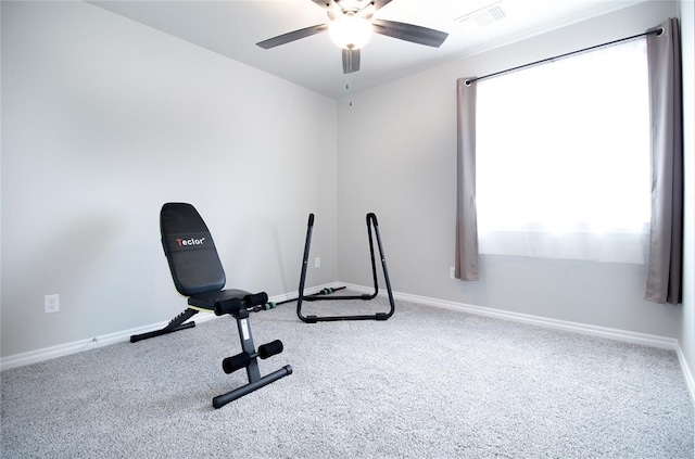 workout area featuring carpet floors and ceiling fan