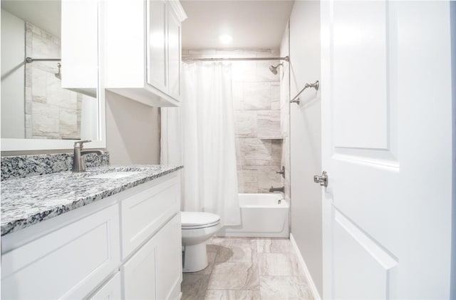 full bathroom with vanity, toilet, and shower / bath combo with shower curtain