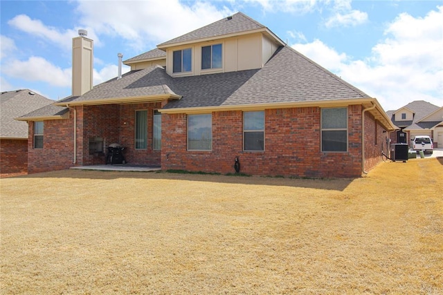 back of house with a yard, a patio area, and central air condition unit