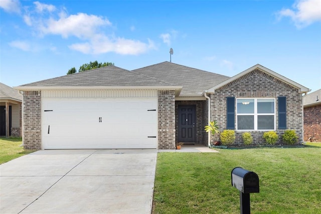 single story home featuring a garage and a front lawn