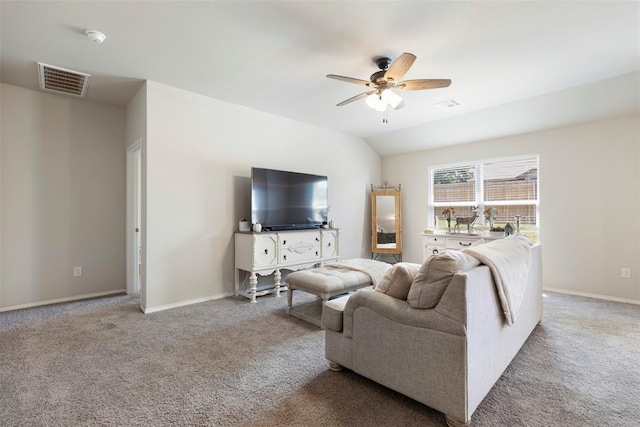 living room with vaulted ceiling, light carpet, and ceiling fan