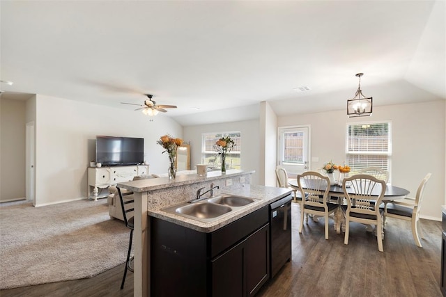 kitchen with sink, dishwasher, an island with sink, pendant lighting, and ceiling fan