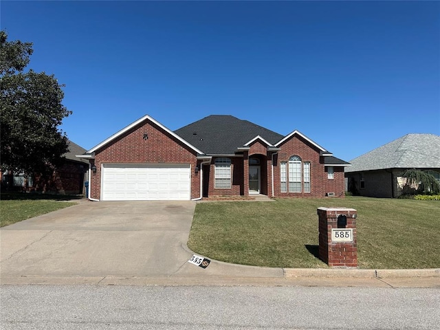 ranch-style home featuring a garage and a front yard