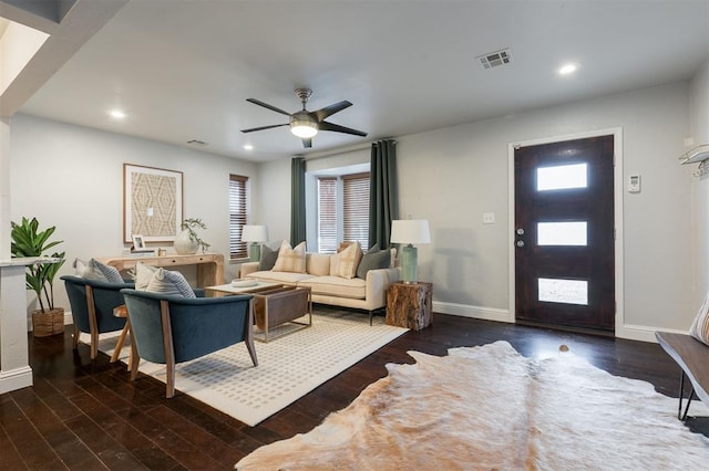 living room with ceiling fan, dark hardwood / wood-style flooring, and a wealth of natural light