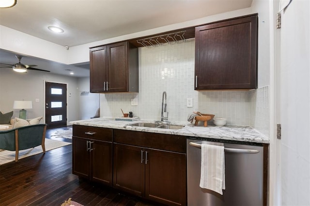 kitchen featuring tasteful backsplash, sink, stainless steel dishwasher, and dark hardwood / wood-style floors