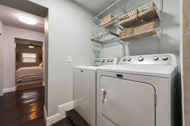 laundry room with ceiling fan, dark hardwood / wood-style flooring, and separate washer and dryer